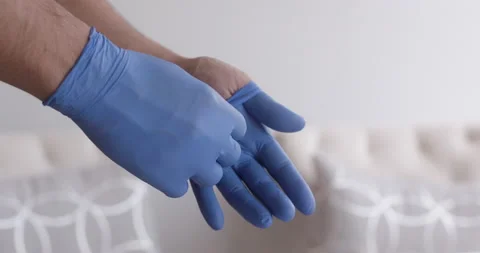 Close up of man putting gloves on 動画素材 130672675