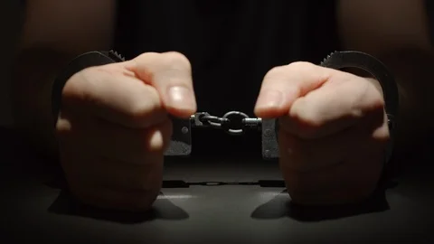 CLOSE UP: Man Putting His Hands With Handcuffed On A Table Video stock 125295312