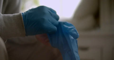 Close up of man putting on rubber gloves 스톡 동영상 138472735