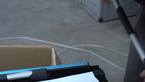Close up of a man putting together pieces of a plastic wardrobe Vidéo 140744886