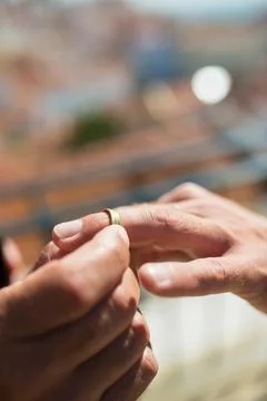 Close-up of man putting wedding ring on boyfriends finger Stock Photos
