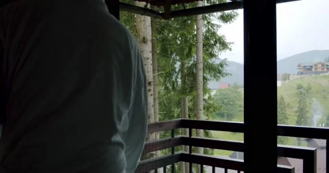 Close up. Man putting a white cup on a wooden railing on nature background. Stock Footage 140390748