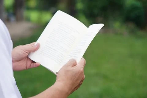 Close up man is reading book. Stock Photos