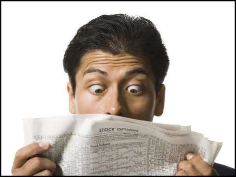 Close-up of man reading newspaper Stock Photos