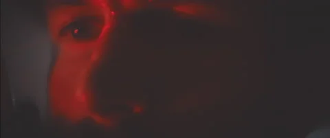 Close up of man in red lights Stock Footage 203562871