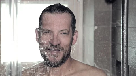 Close up of man relaxing in shower Stock Footage 55393405
