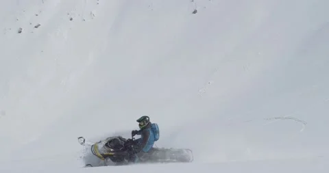 Close. Man rides a snowmobile fast. Tuyuk-Su glacier. Almaty, Kazakhstan Stock Footage 145250307