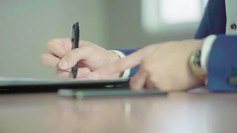 Close up man right hand in blue suit signing document 60fps Stock-Footage 156033771
