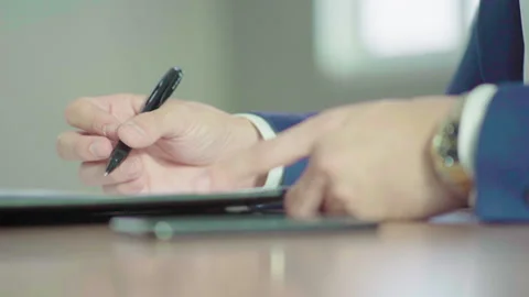 Close up man right hand in blue suit signing document slowmotion 100fps Stock-Footage 156034261