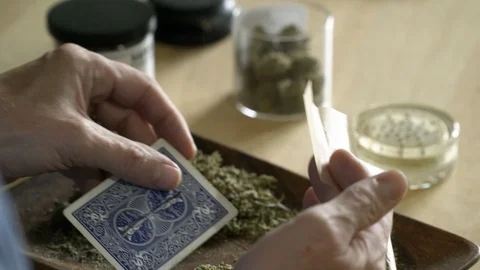 Close up of man rolling joint. Stock Footage 88173940