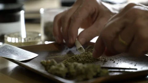 Close up of man rolling joint. Stock Footage 88174038
