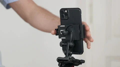 Close Up Of Man Rotating Smartphone Stock Footage 135028318