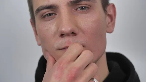 Close up of man rubbing hand on his chin 4k Stock Footage 127540885