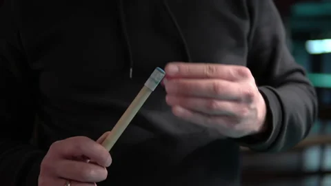 Close-up of a man rubs the tip of a billiard cue with chalk before hitting Stock Footage 146809366