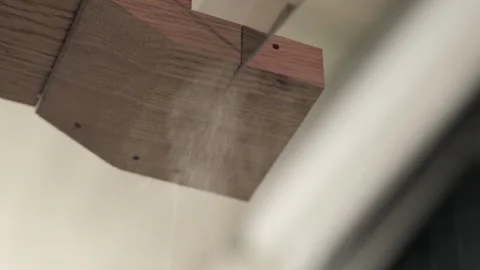 Close up.man sawing a piece from a oak board using a hand saw for wood Stock Footage 156690727
