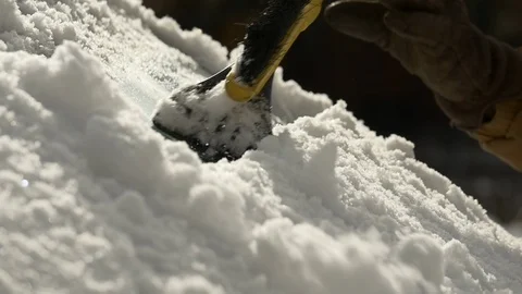 Close up of a man scraping ice and snow from his car windshield. Stock Footage 120419171