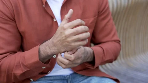 Close up of man scratching his hand suffering from allergic reaction Stock Footage 315559955