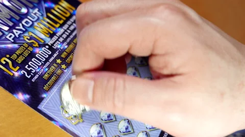 Close up man scratching lottery ticket with 4k resolution Stock Footage 68658185