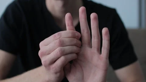 Close-up of man self-massage and relaxation arthritis with stretching finger Stock Footage 327158353