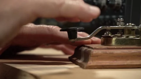 Close up of a man sending a Morse code message on a shortwave radio Stock Footage 201961989