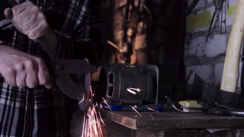 Close-up of a man sharpens a sicator on a grinder sharpener Stock-Footage 140108497