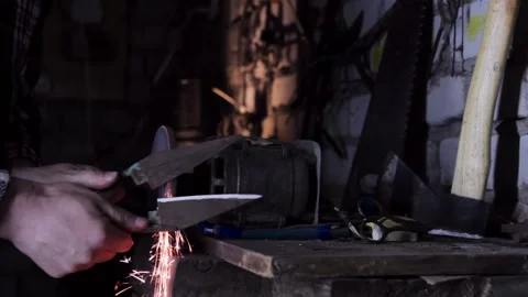Close-up of a man sharpens a sicator on a grinder sharpener. copy space Stock-Footage 140108628