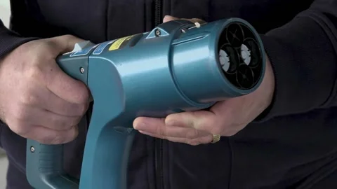 Close up of a Man showing side and front of a Shademo plug for EV charging Stock Footage 154499422
