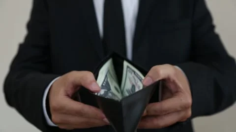 Close Up Man Showing Wallet Full of US Dollars Видео 346181547