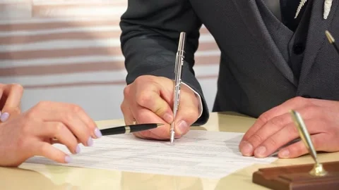 Close-up of a man signing documents Stock Footage 238025877