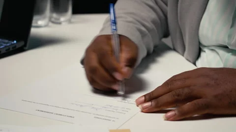 Close up of a man signing work contract with human resources manager Stock Footage 318110764