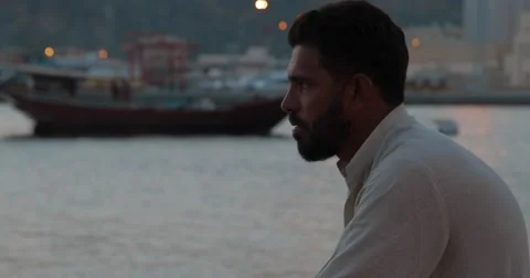 Close up of a Man Sitting at Mutrah Corniche (4K) Stock Footage 45872383