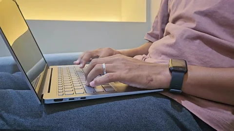 Close Up man sitting on sofa using laptop. Work from home Stock Footage 288943623