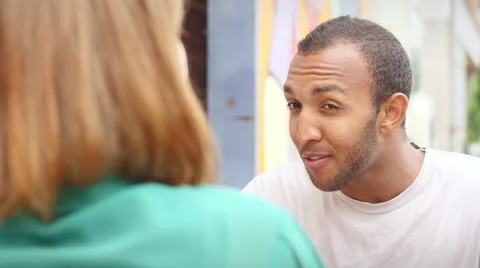 Close up of man sitting at a table talking to his date Stock Footage 44555717