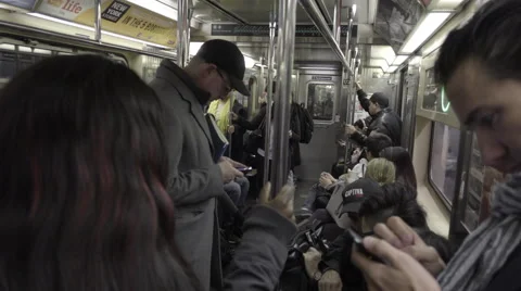 Close-up of man smartphone standing riding crowded subway train interior 4K NYC Vidéo 58756687
