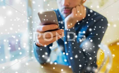 Close up of man with smartphones at cafe Stock Photos