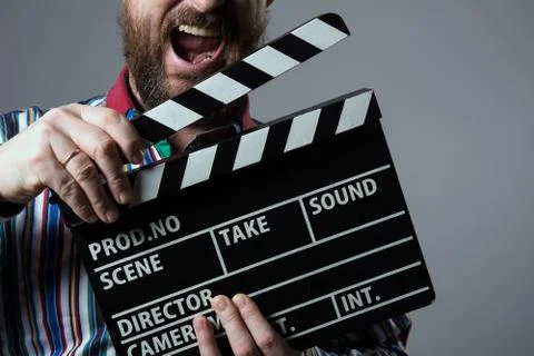Close-up of a man smiling clapperboard cinema Stock Photos