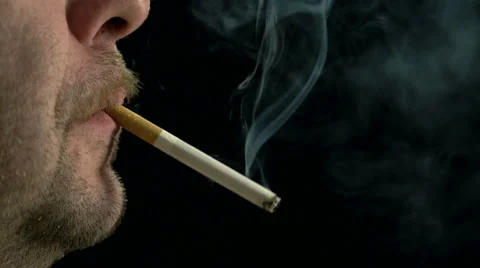 Close up of a man smoking a cigarette. Stock Footage 47228708
