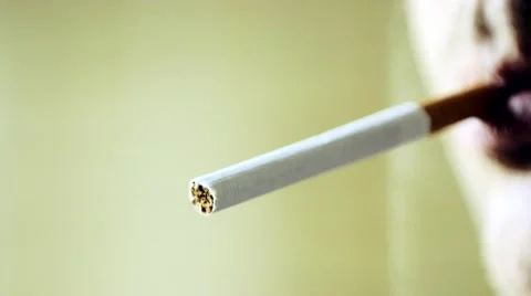 Close up of a man smoking a cigarette Stock Footage 61087917