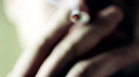 Close up of a man smoking a cigarette Stock Footage 61087932