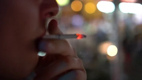 Close-up of a man smoking a cigarette. Stock Footage 77559247