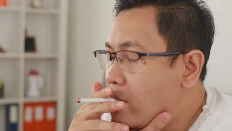 Close up of a man smoking cigarette Stock Footage 141055906