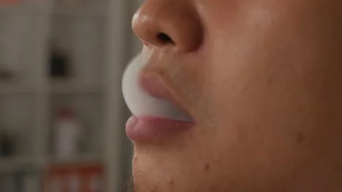 Close up of a man smoking cigarette Stock Footage 141056048