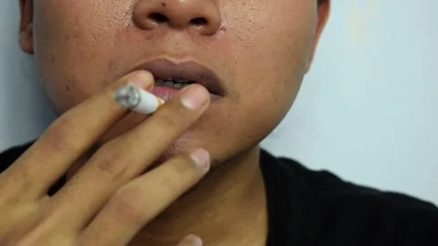 Close up a man smoking with cigarette handmade Stock Footage 252018881