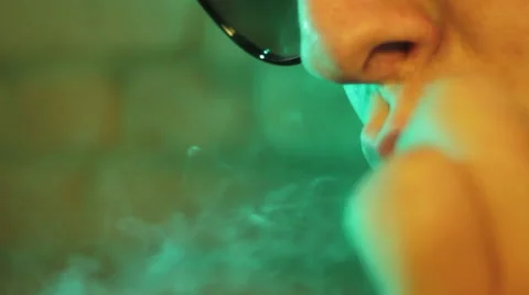 Close up of a man smoking a joint Video stock 56948940
