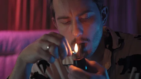 Close-up of a man Smoking a pipe.a man with a mustache and stubble Stock Footage 128460063
