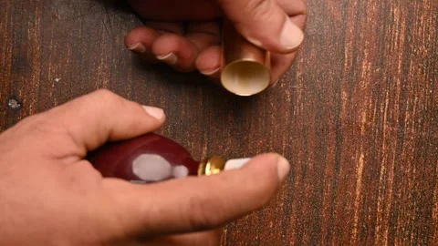 Close-Up of a Man Spraying Perfume on in cap – Personal Care Footage Vidéo 329353094