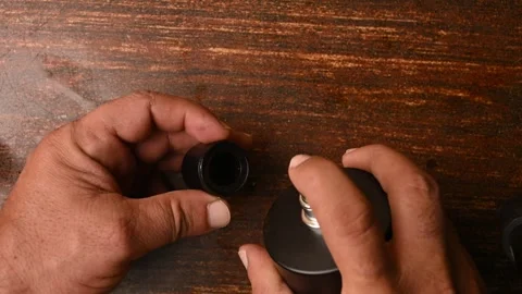 Close-Up of a Man Spraying Perfume on in cap – Personal Care Footage Stock Footage 329353106