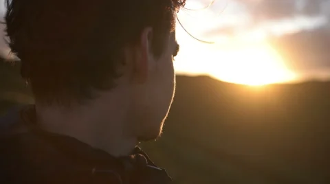 Close up of man staring into the Sunset Stock Footage 59188562