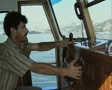 Close up of man steering boat SD Footage