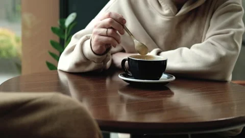 Close up of man stirring coffee in mug Stock Footage 313815635
